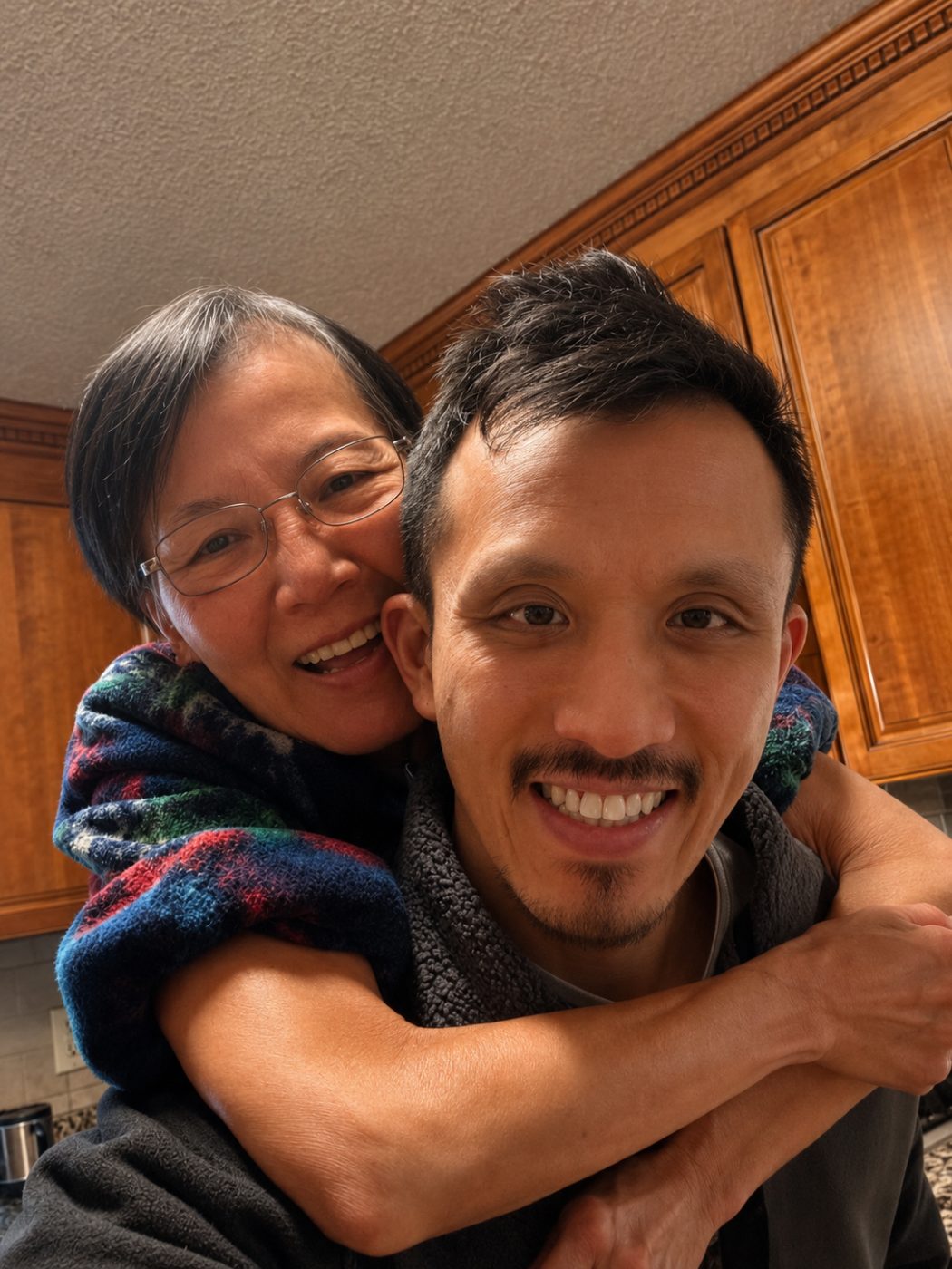 Jeremy with his mom Helen in the kitchen